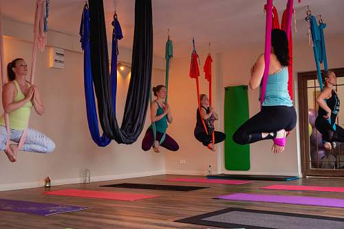 person women doing yoga inside room working out