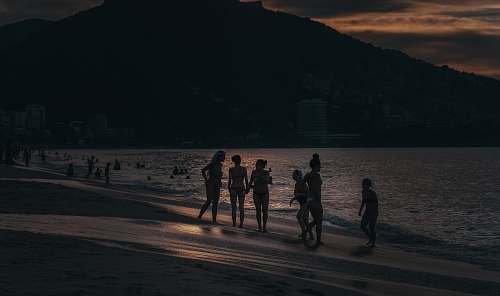 person women wearing bikini along seashore sport