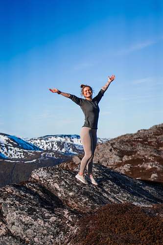 outdoors woman standing on rock formation mountain