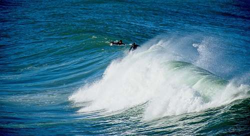 sea person surfing during daytime ocean