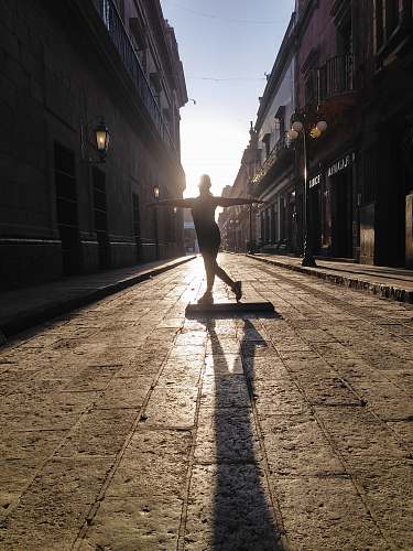 walkway woman standing on exercise board on street pavement