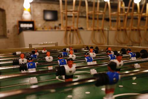 human blue, white, and green foosball table brno