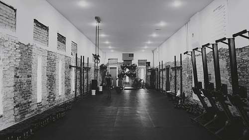 black-and-white grayscale photography of inside building corridor