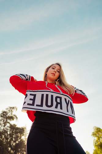 clothing low-angle photography of red and white My Rule jacket apparel