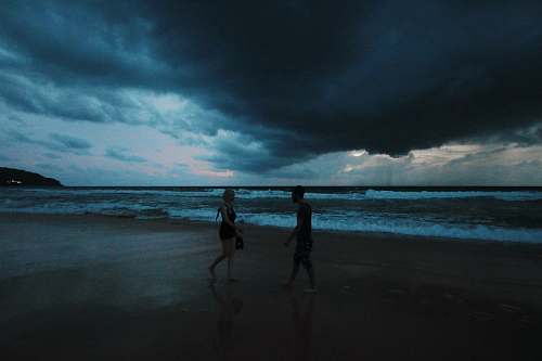 human man and woman on seashore apparel