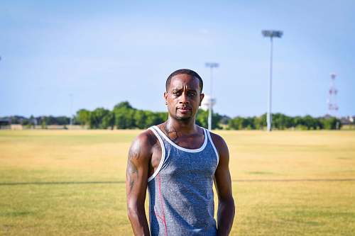 human man wearing gray tank top clothing