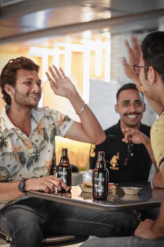 human men sriking beer beverage