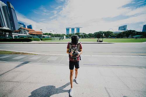 human person holding black DSLR camera people