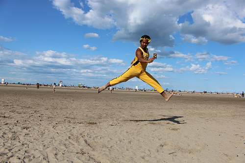 human person wearing yellow jumpsuit outdoors