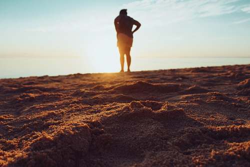 human standing person on brown sand mauritius