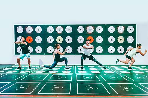 human three men and woman doing exercises people