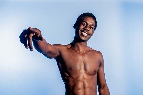 human topless man pointing people