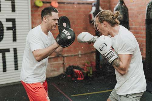 human two men sparring inside boxing gym boxing