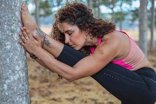 human woman doing yoga in forest skin