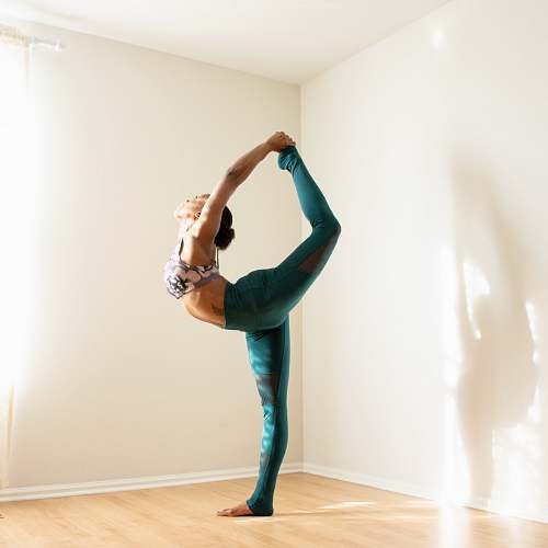 wood woman doing yoga flooring