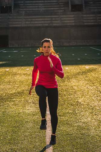 human woman exercising on field sport