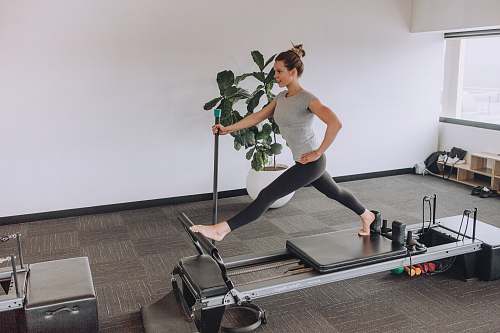 human woman exercising using equipment exercise