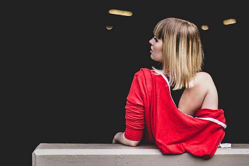 human woman leaning back on railing woman