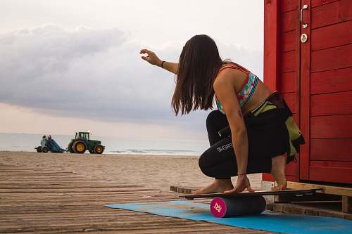 human woman playing balance board wood