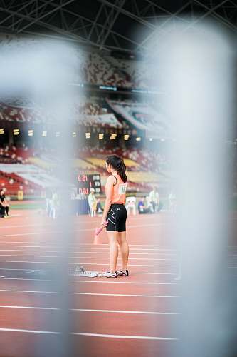 human woman standing holding baton people