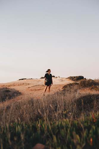 human woman standing on brown field portugal