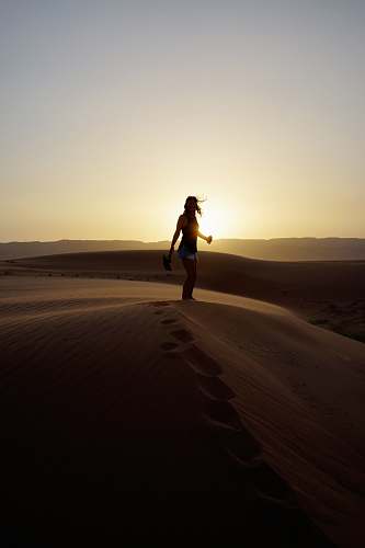 aqaba woman standing on sand during sunset jordan