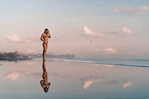human woman wearing black bikini animal