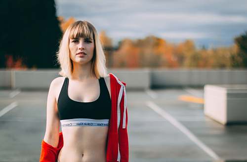 human woman wearing black sports brassiere people