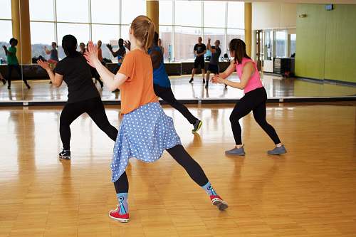 people women dancing near mirror dance