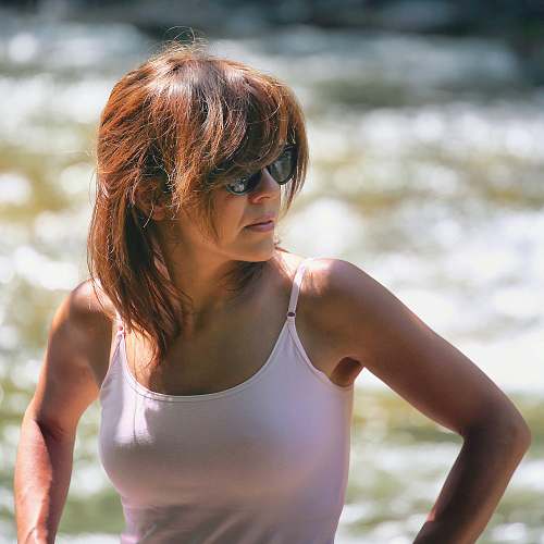 human women's pink spaghetti strap top close-up photography apparel
