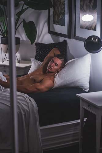 vase man laying on bed pottery