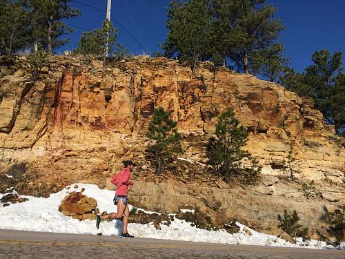 rock person jogging beside clif runner