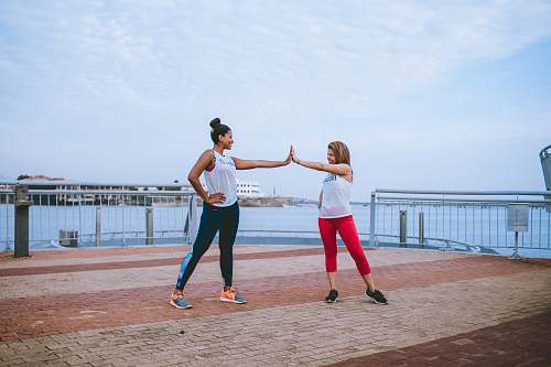 clothing two women's wearing track pants footwear