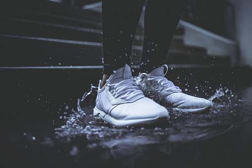 water person standing on body of water shoes