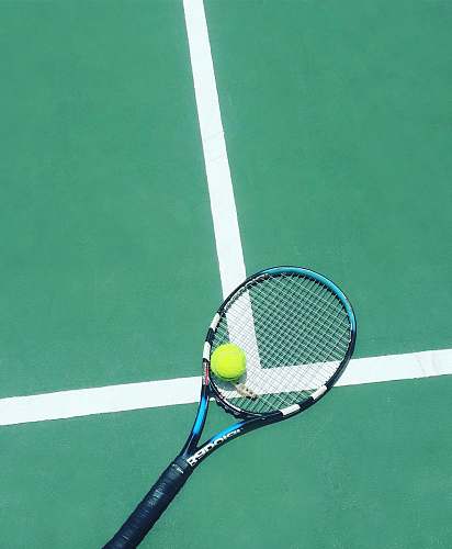 racket tennis racket and ball on field tennis racket