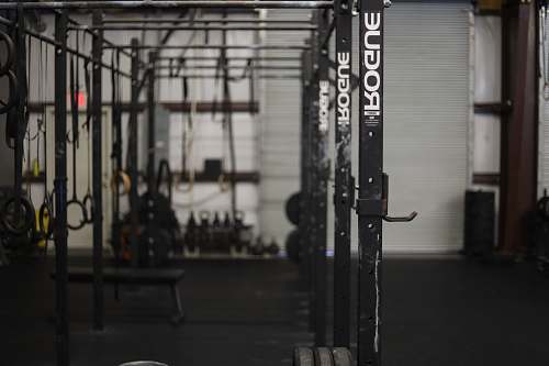 grey black exercise equipment working out