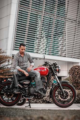 vehicle man sitting on motorcycle motorcycle