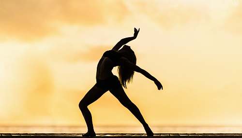 dance silhouette of woman making yoga pose leisure activities