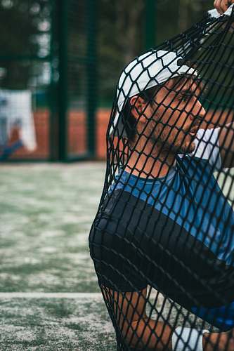 sweden man leaning on black net net